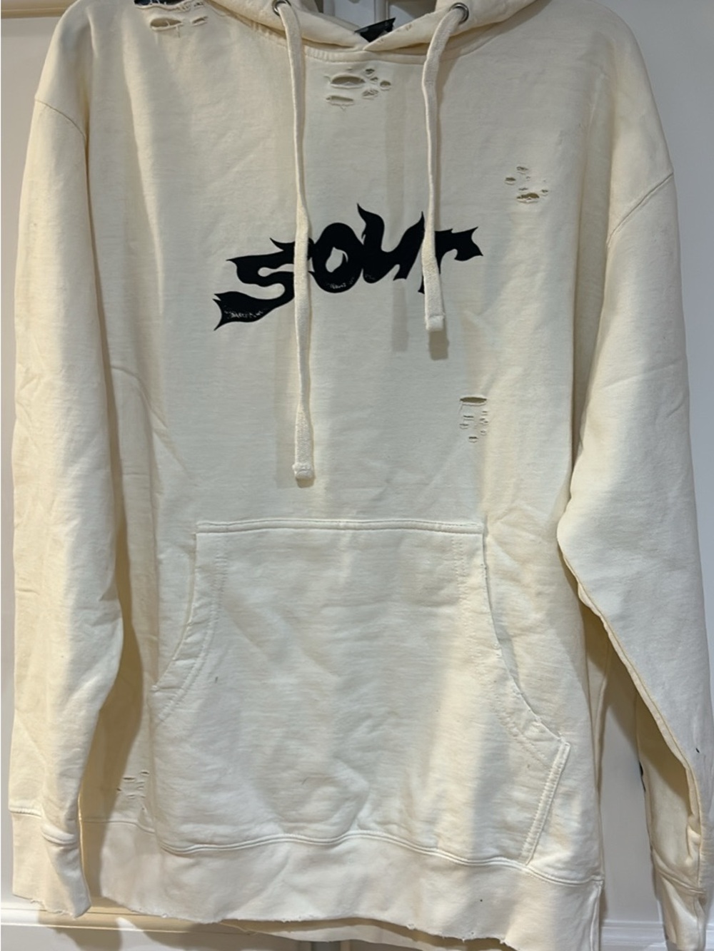 Women's Olivia Rodrigo Cream Distressed Hoodie with Black Graphic